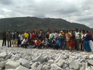 College staff on the dam